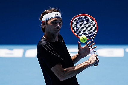 Jan 13, 2023; Melbourne, Victoria, Australia; Taylor Fritz of the United States hits a shot during a practice session on Margaret Court Arena at Melbourne Park. Mandatory Credit: Mike Frey-USA TODAY Sports