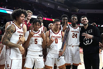 January 14, 2023; Los Angeles, California, USA; Southern California Trojans guard Tre White (22), guard Boogie Ellis (5), forward Kobe Johnson (0) and forward Joshua Morgan (24) pose with former player Nick Rakocevic after the game against the Utah Utes in the second half at Galen Center. Mandatory Credit: Kirby Lee-USA TODAY Sports