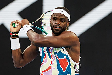 Jan 20, 2023; Melbourne, Victoria, Australia;  Frances Tiafoe of the United States hits a shot against Karen Kachanov of Russia on day five of the 2023 Australian Open tennis tournament at Melbourne Park. Mandatory Credit: Mike Frey-USA TODAY Sports