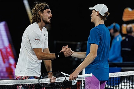 Jan 22, 2023; Melbourne, Victoria, Australia;  Stefanos Tsitsipas of Greece shakes hands with Jannik Sinner of Italy after beating him on day seven of the 2023 Australian Open tennis tournament at Melbourne Park. Mandatory Credit: Mike Frey-USA TODAY Sports