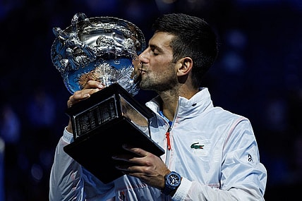 Jan 29, 2023; Melbourne, Victoria, Australia; Novak Djokovic of Serbia poses with the trophy after beating Stefanos Tsitsipas of Greece in the men's final on day fourteen of the 2023 Australian Open tennis tournament at Melbourne Park. Mandatory Credit: Mike Frey-USA TODAY Sports