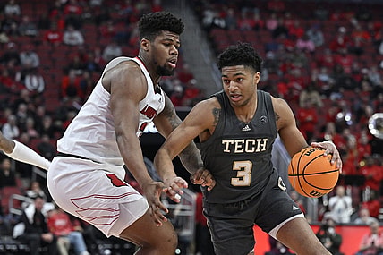 Feb 1, 2023; Louisville, Kentucky, USA;  Georgia Tech Yellow Jackets guard Dallan Coleman (3) dribbles against Louisville Cardinals forward Sydney Curry (21) during the first half at KFC Yum! Center. Mandatory Credit: Jamie Rhodes-USA TODAY Sports