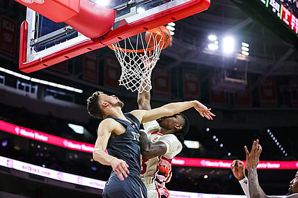 Feb 4, 2023; Raleigh, North Carolina, USA; North Carolina State Wolfpack forward Greg Gantt (23) is fouled by Georgia Tech Yellow Jackets guard Lance Terry (0) during first half against at PNC Arena. Mandatory Credit: Jaylynn Nash-USA TODAY Sports