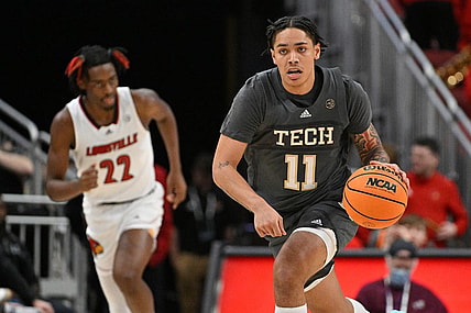 Feb 1, 2023; Louisville, Kentucky, USA;  Georgia Tech Yellow Jackets guard Tristan Maxwell (11) dribbles against the Louisville Cardinals during the first half at KFC Yum! Center. Louisville defeated Georgia Tech 68-58. Mandatory Credit: Jamie Rhodes-USA TODAY Sports