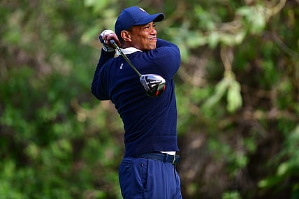 Feb 16, 2023; Pacific Palisades, California, USA; Tiger Woods hits from the twelfth hole tee during the first round of The Genesis Invitational golf tournament. Mandatory Credit: Gary A. Vasquez-USA TODAY Sports