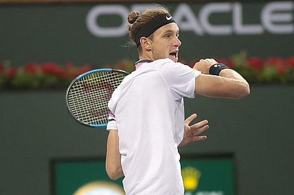 Nicolas Jarry returns a shot to Frances Tiafoe at the BNP Paribas Open, Indian Wells, Calif., March 8, 2019.

Tiafoe 7