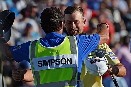 Feb 2, 2020; Scottsdale, Arizona, USA; Webb Simpson hugs his caddie Paul Tesori after winning the Waste Management Phoenix Open golf tournament at TPC Scottsdale. Mandatory Credit: Joe Camporeale-USA TODAY Sports
