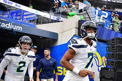 Dec 4, 2022; Inglewood, California, USA; Seattle Seahawks quarterback Geno Smith (7) and quarterback Drew Lock (2) take the field before playing against the Los Angeles Rams at SoFi Stadium. Mandatory Credit: Gary A. Vasquez-USA TODAY Sports