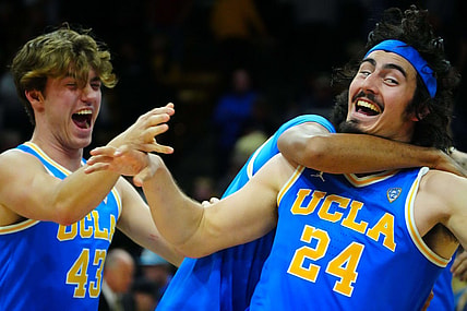 Feb 26, 2023; Boulder, Colorado, USA; UCLA Bruins guard Jaime Jaquez Jr. (24) and guard Russell Stong (43) celebrate defeating the Colorado Buffaloes at the CU Events Center. Mandatory Credit: Ron Chenoy-USA TODAY Sports