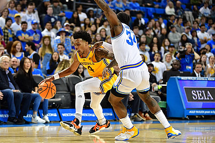 Mar 2, 2023; Los Angeles, California, USA; Arizona State Sun Devils guard Desmond Cambridge Jr. (4) moves to the basket against UCLA Bruins guard David Singleton (34) during the first half at Pauley Pavilion. Mandatory Credit: Gary A. Vasquez-USA TODAY Sports