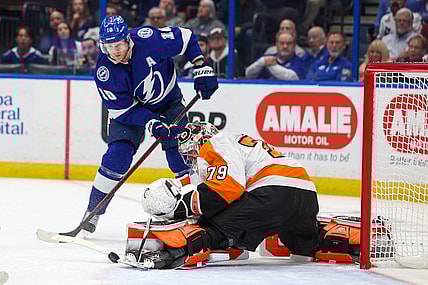 Mar 7, 2023; Tampa, Florida, USA;  Tampa Bay Lightning right wing Corey Perry (10) shoots the puck on Philadelphia Flyers goaltender Carter Hart (79) in the first period at Amalie Arena. Mandatory Credit: Nathan Ray Seebeck-USA TODAY Sports