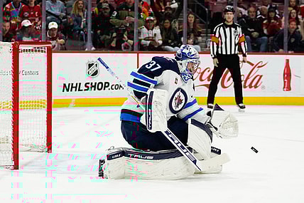 Mar 11, 2023; Sunrise, Florida, USA; Winnipeg Jets goaltender Connor Hellebuyck (37) makes a save against the Florida Panthers during the second period at FLA Live Arena. Mandatory Credit: Rich Storry-USA TODAY Sports