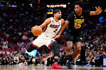 Mar 13, 2023; Miami, Florida, USA; Miami Heat guard Gabe Vincent (2) dribbles the ball past Utah Jazz center Damian Jones (15) during the third quarter at Miami-Dade Arena. Mandatory Credit: Rich Storry-USA TODAY Sports