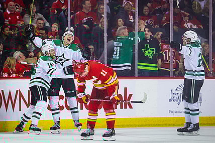 Mar 18, 2023; Calgary, Alberta, CAN; Dallas Stars left wing Jason Robertson (21) celebrates his goal with teammates against the Calgary Flames during the overtime period at Scotiabank Saddledome. Mandatory Credit: Sergei Belski-USA TODAY Sports