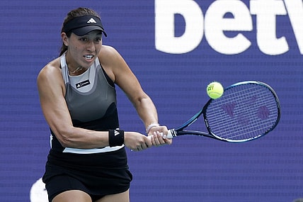 Mar 27, 2023; Miami, Florida, US; Jessica Pegula (USA) hits a backhand against Magda Linette (POL) (not pictured) on day eight of the Miami Open at Hard Rock Stadium. Mandatory Credit: Geoff Burke-USA TODAY Sports