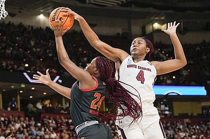 Mar 27, 2023; Greenville, SC, USA; South Carolina Gamecocks forward Aliyah Boston (4) blocks a shot by Maryland Terrapins guard Bri McDaniel (24) during the first half at the NCAA Women   s Tournament at Bon Secours Wellness Arena. Mandatory Credit: Jim Dedmon-USA TODAY Sports
