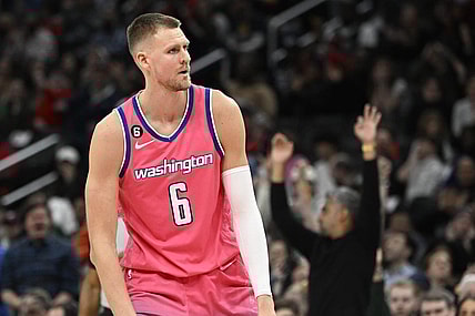 Mar 28, 2023; Washington, District of Columbia, USA; Washington Wizards center Kristaps Porzingis (6) reacts after a basket against the Boston Celtics during the second half at Capital One Arena. Mandatory Credit: Brad Mills-USA TODAY Sports