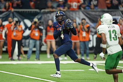 Dec 2, 2022; San Antonio, Texas, USA;  UTSA Roadrunners wide receiver Zakhari Franklin (4) catches a touchdown in the second half against the North Texas Mean Green at the Alamodome. Mandatory Credit: Daniel Dunn-USA TODAY Sports
