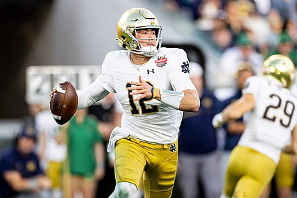 Dec 30, 2022; Jacksonville, FL, USA; Notre Dame Fighting Irish quarterback Tyler Buchner (12) looks to throw during the first half against the South Carolina Gamecocks in the 2022 Gator Bowl at TIAA Bank Field. Mandatory Credit: Matt Pendleton-USA TODAY Sports