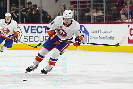 Apr 2, 2023; Raleigh, North Carolina, USA;  New York Islanders center Bo Horvat (14) skates with the puck against the Carolina Hurricanes during the second period at PNC Arena. Mandatory Credit: James Guillory-USA TODAY Sports