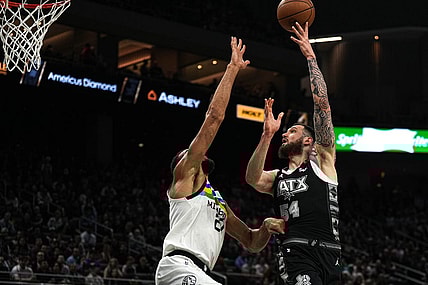 April 8, 2023; Austin, TX, USA; San Antonio Spurs forward Sandro Mamukelashvili (54) shoots over Minnesota Timberwolves center Rudy Gobert (27) during the game at the Moody Center on Saturday, April 8, 2023 in Austin. Mandatory Credit: Aaron E. Martinez-USA TODAY NETWORK