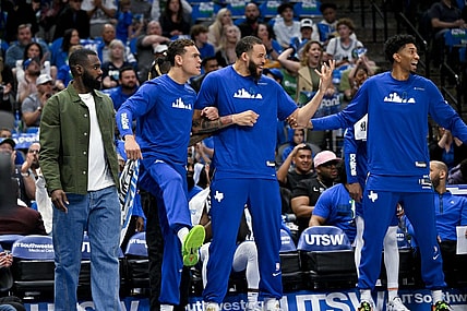 Apr 9, 2023; Dallas, Texas, USA; Dallas Mavericks forward Tim Hardaway Jr. (11) and center Dwight Powell (7) and center JaVale McGee (00) and forward Christian Wood (35) celebrate on the team bench during the second quarter against the San Antonio Spurs at the American Airlines Center. Mandatory Credit: Jerome Miron-USA TODAY Sports