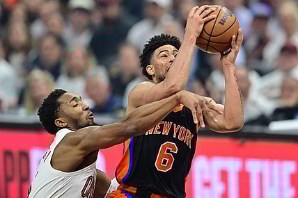 Apr 18, 2023; Cleveland, Ohio, USA; Cleveland Cavaliers guard Donovan Mitchell (45) fouls New York Knicks guard Quentin Grimes (6) during the first quarter of game two of the 2023 NBA playoffs at Rocket Mortgage FieldHouse. Mandatory Credit: Ken Blaze-USA TODAY Sports