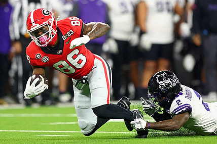 Jan 9, 2023; Inglewood, CA, USA; Georgia Bulldogs quarterback Collin Drake (26) runs with the ball against TCU Horned Frogs cornerback Kee'Yon Stewart (2) during the third quarter of the CFP national championship game at SoFi Stadium. Mandatory Credit: Mark J. Rebilas-USA TODAY Sports