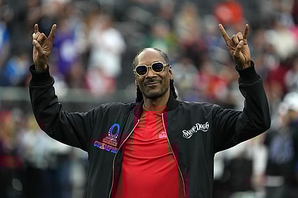 Feb 5, 2023; Paradise, Nevada, USA; AFC captain and recording artist Snoop Dogg watches from the sidelines against the NFC during the Pro Bowl Games at Allegiant Stadium. Mandatory Credit: Kirby Lee-USA TODAY Sports