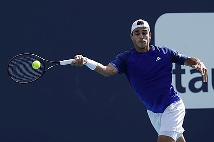 Mar 30, 2023; Miami, Florida, US; Francisco Cerundolo (ARG) hits a forehand against Karen Khachanov (not pictured) in a men's singles quarterfinal on day eleven of the Miami Open at Hard Rock Stadium. Mandatory Credit: Geoff Burke-USA TODAY Sports