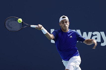 Mar 30, 2023; Miami, Florida, US; Francisco Cerundolo (ARG) hits a forehand against Karen Khachanov (not pictured) in a men's singles quarterfinal on day eleven of the Miami Open at Hard Rock Stadium. Mandatory Credit: Geoff Burke-USA TODAY Sports