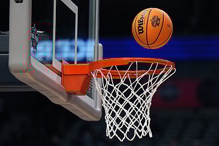 Mar 30, 2023; Dallas, TX, USA;  A Wilson EVO NXT basketball with the NCAA Women's Final Four logo goes through the rim and net at American Airlines Center. Mandatory Credit: Kirby Lee-USA TODAY Sports