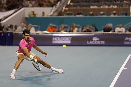 Mar 31, 2023; Miami, Florida, US; Carlos Alcaraz (ESP) reaches for a forehand against Jannik Sinner (ITA) (not pictured) in a men's singles semifinal on day twelve on the Miami Open at Hard Rock Stadium. Mandatory Credit: Geoff Burke-USA TODAY Sports