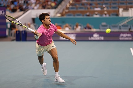 Mar 31, 2023; Miami, Florida, US; Carlos Alcaraz (ESP) reaches for a forehand against Jannik Sinner (ITA) (not pictured) in a men's singles semifinal on day twelve on the Miami Open at Hard Rock Stadium. Mandatory Credit: Geoff Burke-USA TODAY Sports