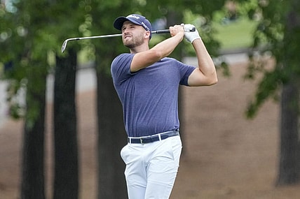 May 7, 2023; Charlotte, North Carolina, USA; Wyndham Clark hits his approach shot on five during the final round of the Wells Fargo Championship golf tournament. Mandatory Credit: Jim Dedmon-USA TODAY Sports