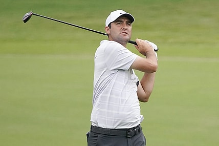 May 12, 2023; McKinney, Texas, USA; Scottie Scheffler watches shot on the 18th hole during the second round of the AT&T Byron Nelson golf tournament. Mandatory Credit: Raymond Carlin III-USA TODAY Sports