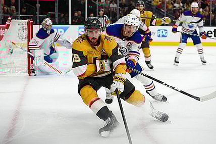 May 12, 2023; Las Vegas, Nevada, USA; Vegas Golden Knights right wing Reilly Smith (19) skates ahead of Edmonton Oilers center Ryan Nugent-Hopkins (93) during the third period of game five of the second round of the 2023 Stanley Cup Playoffs at T-Mobile Arena. Mandatory Credit: Stephen R. Sylvanie-USA TODAY Sports