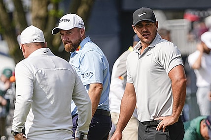 May 15, 2023; Rochester, New York, USA; Brooks Koepka (right) and Marc Leishman stand on the putting green during a practice round of the PGA Championship golf tournament at Oak Hill Country Club. Mandatory Credit: Adam Cairns-USA TODAY Sports