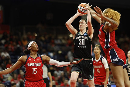 May 19, 2023; Washington, District of Columbia, USA; New York Liberty forward Breanna Stewart (30) shoots the ball as Washington Mystics guard Brittney Sykes (15) and Mystics center Shakira Austin (0) defend in the second quarter at Entertainment & Sports Arena. Mandatory Credit: Geoff Burke-USA TODAY Sports