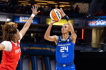 May 19, 2023; Indianapolis, Indiana, USA; Connecticut Sun forward DeWanna Bonner (24)  shoots the ball while Indiana Fever forward Nalyssa Smith (1) defends in the first half at Gainbridge Fieldhouse. Mandatory Credit: Trevor Ruszkowski-USA TODAY Sports