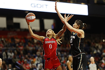 May 19, 2023; Washington, District of Columbia, USA; Washington Mystics center Shakira Austin (0) shoots the ball as New York Liberty center Han Xu (21) defends at Entertainment & Sports Arena. Mandatory Credit: Geoff Burke-USA TODAY Sports