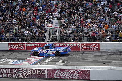 May 20, 2023; North Wilkesboro, North Carolina, USA;  NASCAR Craftsman Truck Series driver Kyle Larson (7) crosses the finish line during the Tyson 250 at North Wilkesboro Speedway. Mandatory Credit: Jim Dedmon-USA TODAY Sports