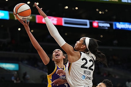 May 25, 2023; Los Angeles, California, USA; LA Sparks guard Kianna Smith (5) shoots the ball against Las Vegas Aces forward A'ja Wilson (22) during the first half at Crypto.com Arena. Mandatory Credit: Kirby Lee-USA TODAY Sports