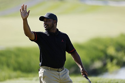 May 25, 2023; Washington, DC, USA; Harold Varner III waves to the crowd after making a birdie putt on the eighteenth hole during the first round of the LIV Golf DC 2023 tournament at Trump National Golf Club in Sterling, Va. Mandatory Credit: Geoff Burke-USA TODAY Sports