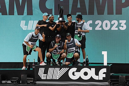 May 28, 2023; Potomac Falls, Virginia, USA; Members of Team Torque celebrate on the podium after winning the team championship of LIV Golf Washington, D.C. golf tournament at Trump National. Mandatory Credit: Geoff Burke-USA TODAY Sports