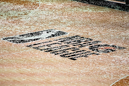 Mar 11, 2021; Orlando, Florida, USA; The NBA G League logo is covered in confetti after the Final between the Delaware Blue Coats and the Lakeland Magic at AdventHealth Arena. Mandatory Credit: Mary Holt-USA TODAY Sports