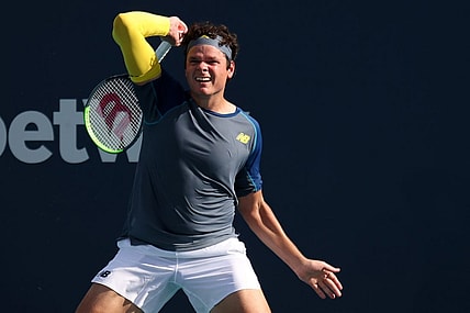 Mar 30, 2021; Miami, Florida, USA; Milos Raonic of Canada hits a forehand against Hubert Hurkacz of Poland (not pictured) in the fourth round in the Miami Open at Hard Rock Stadium. Mandatory Credit: Geoff Burke-USA TODAY Sports