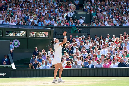 Jul 9, 2022; London, England, United Kingdom; Ons Jabeur (TUN) throws her racquet in the air in frustration during her women s singles final against Elena Rybakina (KAZ) on Centre court at All England Lawn Tennis and Croquet Club. Mandatory Credit: Peter van den Berg-USA TODAY Sports