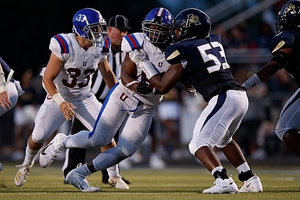Dion Stutts (62) of MUS and Tre Jones (53) of Arlington  during the game between the Arlington Tigers and MUS Owls on Friday August, 19th 2022 in Arlington, Tn (Justin Ford/Special to the Commercial Appeal)

Arlingtonvsmus0020