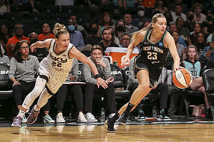 Aug 23, 2022; Brooklyn, New York, USA; New York Liberty guard Marine Johannes (23) steals the ball from Chicago Sky guard Courtney Vandersloot (22) in the third quarter at Barclays Center. Mandatory Credit: Wendell Cruz-USA TODAY Sports